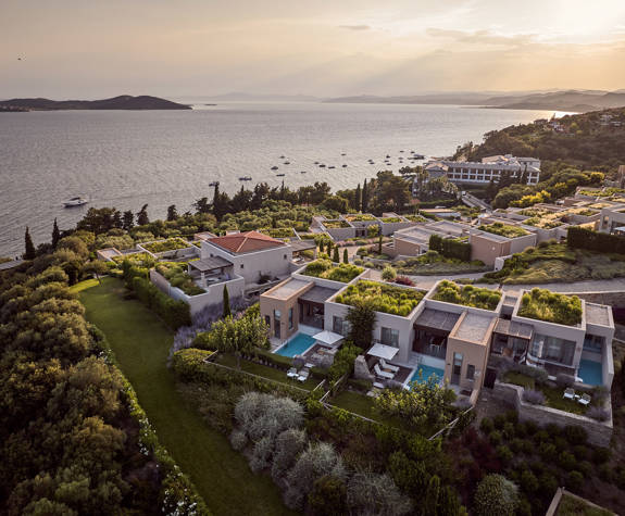 Eagles Resort Chalkidiki aerial view, pools, suites, sea, blue sky and nature