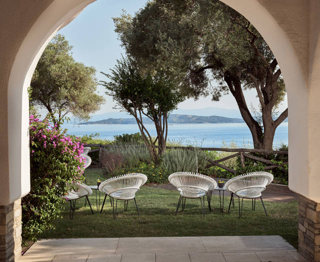 Eagles Resort Club with garden furnitures under the trees